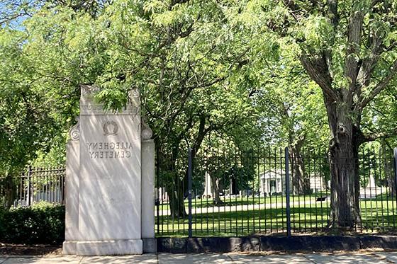 Photo of the entrance to Allegheny Cemetery, on a sunny summer day