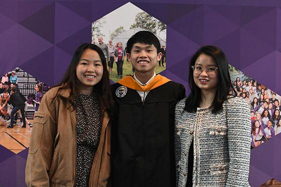 Photo of a graduating Chatham University student wearing a rainbow stole, with an arm over the shoulder of a parent or guardian